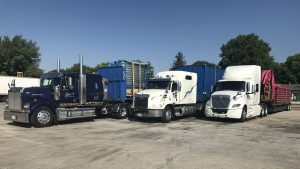 Jonker Trucking flatbeds moving Carnival Equipment